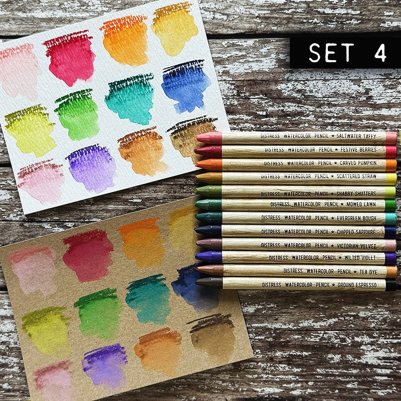 Woodless Watercolour Pencils in Distress colours, set 4 ... by Tim Holtz and Ranger. 12 (twelve) woodless watercolour pencils in Saltwater Taffy, Festive Berries, Carved Pumpkin, Scattered Straw, Shabby Shutters, Mowed Lawn, Evergreen Bough, Chipped Sapphire, Victorian Velvet, Wilted Violet, Tea Dye, Ground Espresso. One of each colour, approx 5" long. Photo of Tim Holtz's swatches with the 12 pencils.