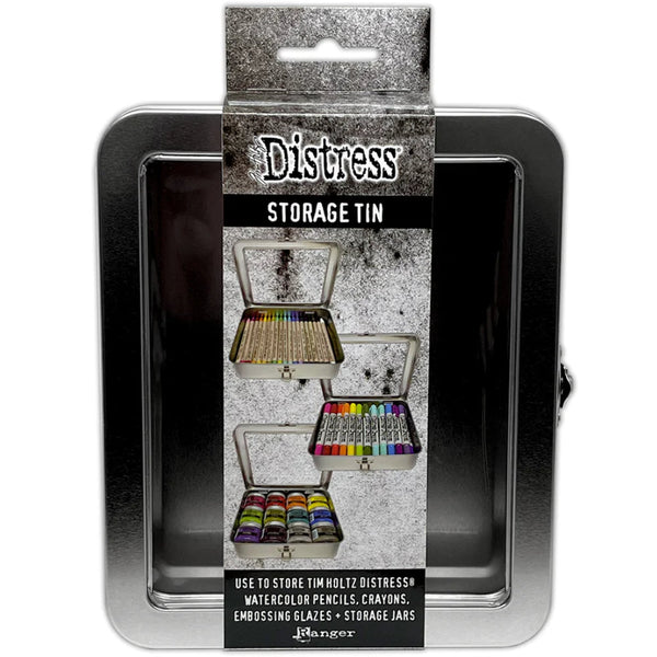 Distress Storage Tin ... by Tim Holtz and Ranger - 1 (one) empty metal container with hinged lid and window. Originally named the "Distress Crayon Storage Tin". Holds up to ... - 34 x Distress Crayons, - 12 x Distress Embossing Glaze, - 12 x Ranger and Distress 1oz sized jars, - 12 x jars of Ranger Stickles Gel, - 70 x Distress Woodless Watercolour Pencils, - 4 x rolls of Idea-Ology Collage paper, ... and anything else you can fit in this handy sized tin. Tin size : (approx) 6" x 7" x 2".