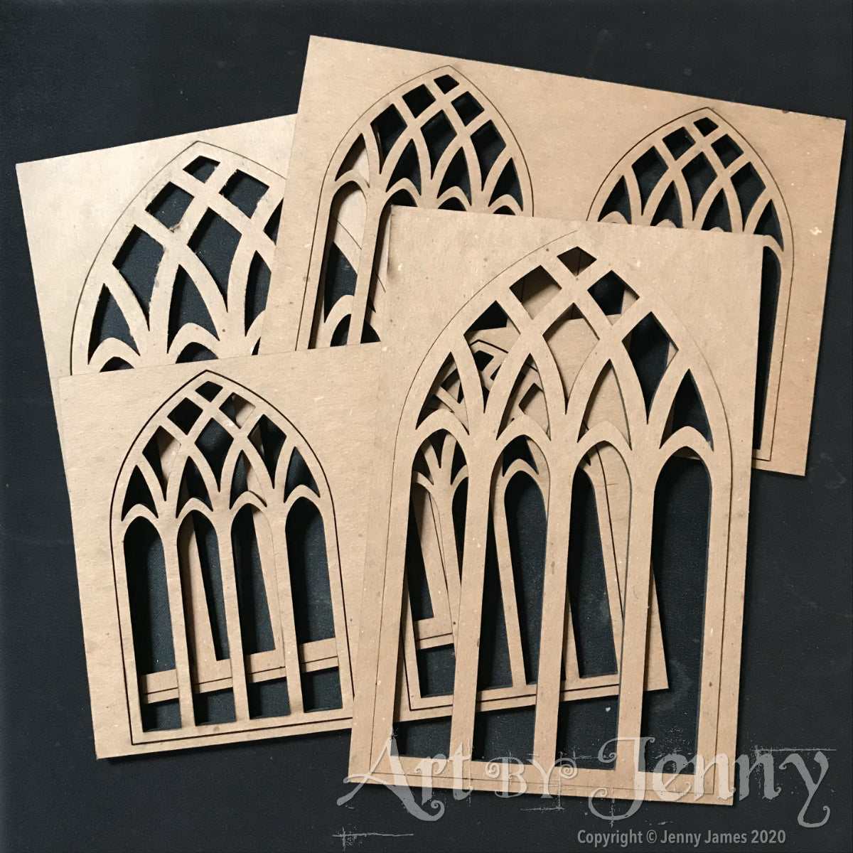 Cathedral Windows - Etcetera by Tim Holtz ... Thickboard artboards with cutout leadlight patterns on an arched shape with rectangle frame. Ideal to use for decorative elements, altering and creating visual arts. Set comprises of 4 (four) small windows, 2 (two) large windows, each 3mm thick, overall base is 4 1/2" x 6 3/4". Total of 6 (six) pieces. Made by Stampers Anonymous with Tim Holtz. THETC015. Photo of the laser cut shapes.