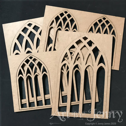 Cathedral Windows - Etcetera by Tim Holtz ... Thickboard artboards with cutout leadlight patterns on an arched shape with rectangle frame. Ideal to use for decorative elements, altering and creating visual arts. Set comprises of 4 (four) small windows, 2 (two) large windows, each 3mm thick, overall base is 4 1/2" x 6 3/4". Total of 6 (six) pieces. Made by Stampers Anonymous with Tim Holtz. THETC015. Photo of the laser cut shapes.