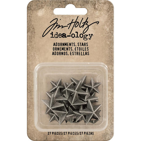 Stars ... by Tim Holtz Idea-Ology - 3D (3 dimensional) 5-pointed stars made of matte metal in a pewter or silver colouring. Flat backed for easy attachment for all kinds of creativity. 27 (twenty seven) stars in 3 different sizes, 5/16" (7-8mm) wide, 1/2" (12mm) wide, and 3/4" (19mm) wide. Tim Holtz 3D Stars are cast in an antique silver coloured metal, ideal for mixed media, scrapbooking, seasonal projects, display boxes, frames, dioramas, home decor or create a starry sky on a ceiling. TH93562
