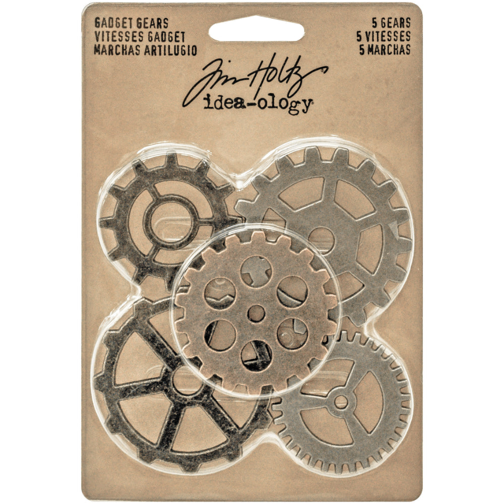 Gadget Gears ... Idea-Ology Adornments by Tim Holtz. Flat large metal cogs for use for mixed media, decorating books or displays, dioramas, off-the-page crafts, steampunk projects and creative visual arts. Pack of 5 (five) gears, one of each kind. Sizes (approx) : smallest two are 1 1/2" (38mm x 38mm), cog with round holes is 1 3/4" (43mm x 43mm), larger two cogs are 2" (50mm x 50mm) TH93297.