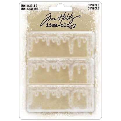 Mini Icicles - by Tim Holtz Idea-Ology ... sculpted translucent trim made of clear plastic in the shape of drippy looking edges. Add to your cards, artwork, display box, frame or other project. 3 (three) pieces each 2 3/4" wide x 1" high. Make these 3 miniature icicle ledges into whatever you wish - icicles, stalactites, drippy paint, drippy candle wax, use up or down (hanging or growing), mud drippy ledges, mossy edging... anything you wish! TH94450. Packaging.
