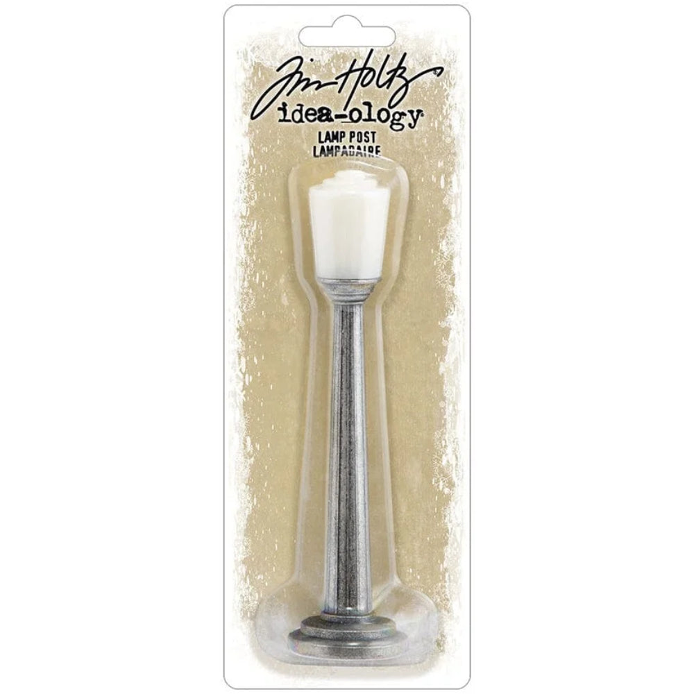Lamp Post ... Idea-Ology Metal Adornments by Tim Holtz. With a tall silver coloured metal column to hold a removable light fitting, this vintage inspired lamppost is perfect for use as embellishments in mixed media, display makes, home decor, all kinds of visual creative arts. 1 (one) lamppost made of 2 parts (stem and light), approx 4.98" tall. Photo of the light in packaging. TH94497