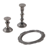 The Manor (Oval Frame and Candlesticks) ... by Tim Holtz Idea-Ology TH94340 - Metal realistic miniature ornate models of a beautiful oval frame and two sculptured candlesticks. Pack of 3 pieces, one frame 2 1/4" x 1 3/4" wide, one short stand 1" tall, one tall stand 1 3/4" tall.   Tim Holtz Idea-Ology Adornments are made of metal in an antique silver colouring to use in diy projects, home decor, mixed media and visual arts. Photo of the pieces showing details.