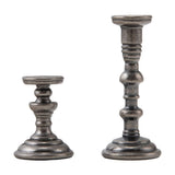 The Manor (Oval Frame and Candlesticks) ... by Tim Holtz Idea-Ology TH94340 - Metal realistic miniature ornate models of a beautiful oval frame and two sculptured candlesticks. Pack of 3 pieces, one frame 2 1/4" x 1 3/4" wide, one short stand 1" tall, one tall stand 1 3/4" tall.   Tim Holtz Idea-Ology Adornments are made of metal in an antique silver colouring to use in diy projects, home decor, mixed media and visual arts. Photo of the stands at the side.