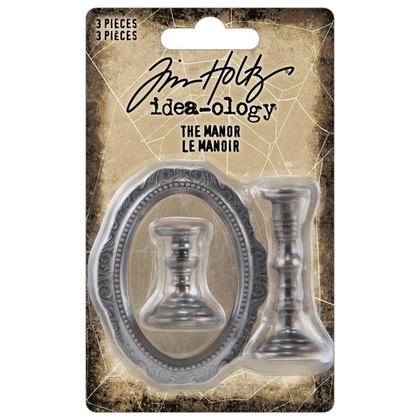 The Manor (Oval Frame and Candlesticks) ... by Tim Holtz Idea-Ology TH94340 - Metal realistic miniature ornate models of a beautiful oval frame and two sculptured candlesticks. Pack of 3 pieces, one frame 2 1/4" x 1 3/4" wide, one short stand 1" tall, one tall stand 1 3/4" tall.   Tim Holtz Idea-Ology Adornments are made of metal in an antique silver colouring to suit any themed artwork including boxes, frames, dioramas, home decor, dimensional mixed media, or a mantlepiece of your model of a Manor House. 
