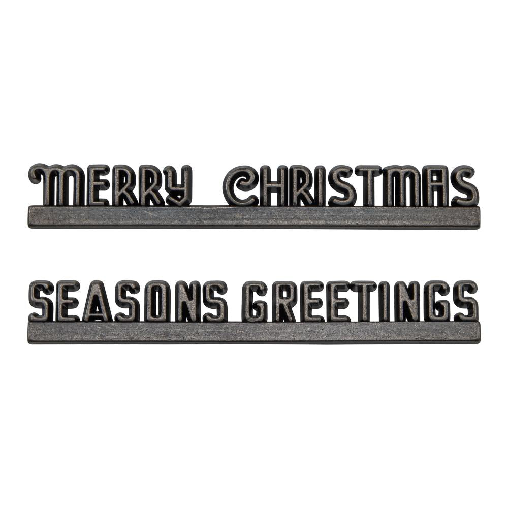 Christmas Marquee ... Idea-Ology Adornments by Tim Holtz. Beautifully detailed bright silver coloured metal typographical banners with flat bases to use as embellishments for Christmas display makes, dioramas, mixed media, paper crafts, cardmaking, junk journals, scrapbooking and visual arts. 2 (two) pieces, 4 1/2" wide. One of each phrase (Seasons Greetings, Merry Christmas).