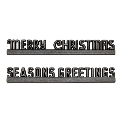 Christmas Marquee ... Idea-Ology Adornments by Tim Holtz. Beautifully detailed bright silver coloured metal typographical banners with flat bases to use as embellishments for Christmas display makes, dioramas, mixed media, paper crafts, cardmaking, junk journals, scrapbooking and visual arts. 2 (two) pieces, 4 1/2" wide. One of each phrase (Seasons Greetings, Merry Christmas).