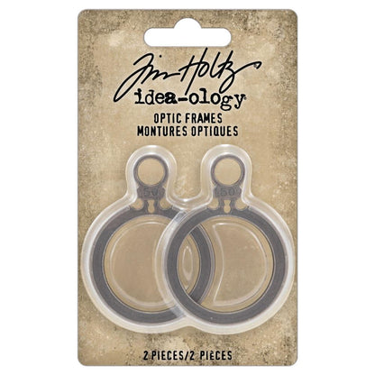 Optic Frames ... Idea-Ology Adornments by Tim Holtz. 2 (two) round open frames with tabs, each made of metal, used for mixed media, decorating ornaments, home decor makes and visual arts.&nbsp;  Tim Holtz Idea-Ology Metal Adornments are finished in an antique style pewter colour. Ideal for all kinds of excuses to create - visual arts, sculpture, mixed media canvas, decorating trays, clocks, boxes and frames. Use to display tiny works of art or layer onto mixed media. TH94375