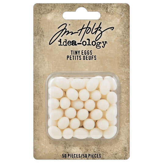 Tiny Eggs - Idea-Ology Resin Models by Tim Holtz ... miniature eggs made of white resin to use in mixed media, off-the-page projects, greeting cards, dimensional artwork, papercrafts and visual arts of all the fun kinds. TH94304 . Packet of 50 (fifty) pieces. Packaged of tiny realistic eggs with 'Tim Holtz idea-ology' branding with bundle of eggs in a square enclosure