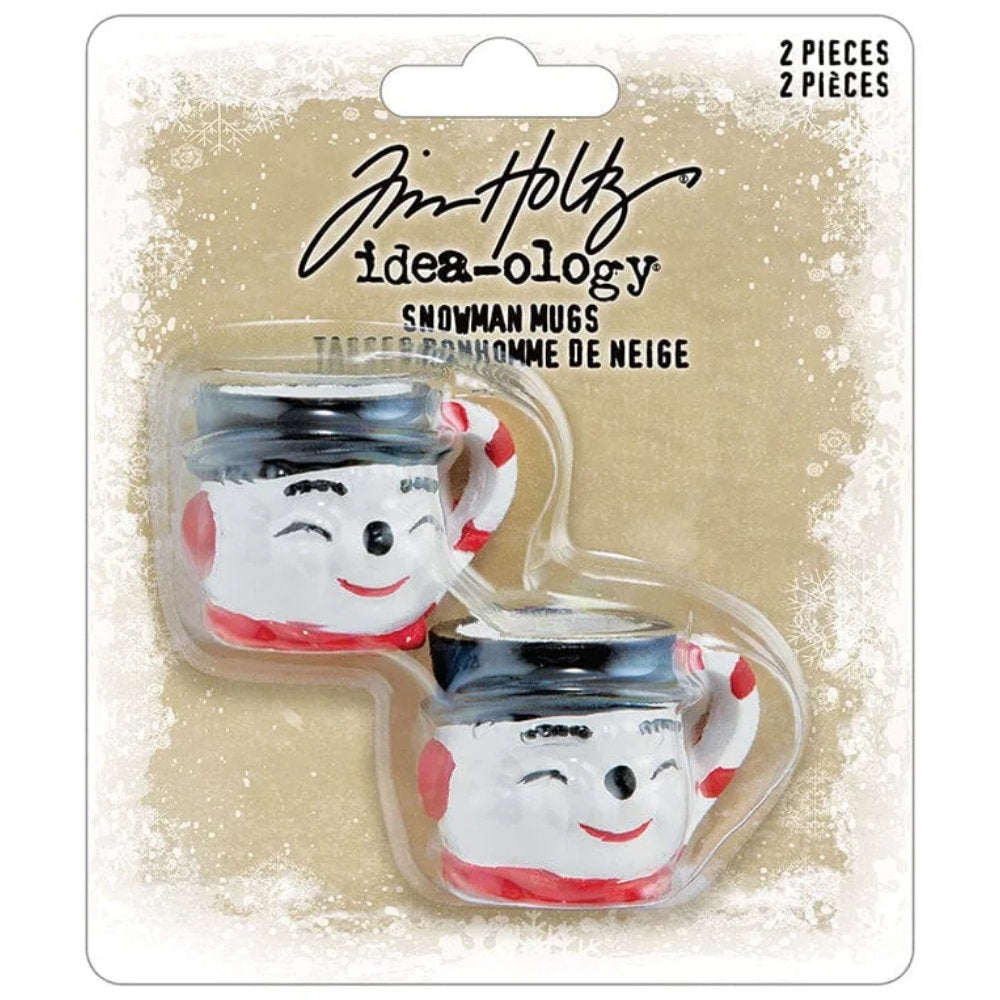 Snowman Mugs - Idea-Ology Resin Models ... by Tim Holtz - Miniature 1 1/8" high dimensional Frosty the Snowman styled character mugs made of resin for decor, assemblage projects, diorama, off-the-page marvels and party decor. Pack of 2 (two) mugs. Each mug is shaped into the smiling face of a snowman with black hat, red scarf, and a red-white striped handle. TH94501