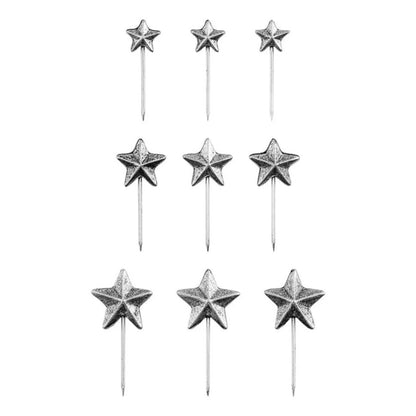 Star Pins, Christmas 2026 ... Idea-Ology Adornments by Tim Holtz. Beautifully made silver coloured sharp pins topped with 5-pointed stars, to use as embellishments for Christmas and other celebrations on display makes, dioramas, mixed media, paper crafts, mixed media and visual arts. 9 (nine) pins, 3 of each sized star. TH94498. Photo of the stars showing smallest at the top and largest at the bottom of the image.