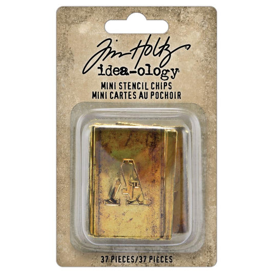 Stencil Chips, Mini ... Idea-Ology Adornments by Tim Holtz. Die cut labels with cut out letters and numbers made of thin chipboard, to use for mixed media, decorating ornaments, home decor makes and visual arts. Thin paperstock, chipboard with rustic brass metallic finish. 37(thirty seven) pieces, one of each A to Z, 0 to 9 and an ampersand (&). TH94383