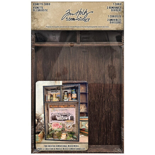 Vignette Curio (Tray, Box) ... by Tim Holtz Idea-Ology. Wooden, shallow, open-top box or tray with removable dividers or shelves. Use to create dimensional artwork for home decor, gifts, creative frames or mixed media projects. 1 (one) tray. Tim Holtz Idea-Ology Vignette Tray is an open-topped box is made of real timber, stained in a dark brown. Fantastic for creating gifts, assemblage, displays, frames, dimensional art, dioramas, mixed media projects. TH94505