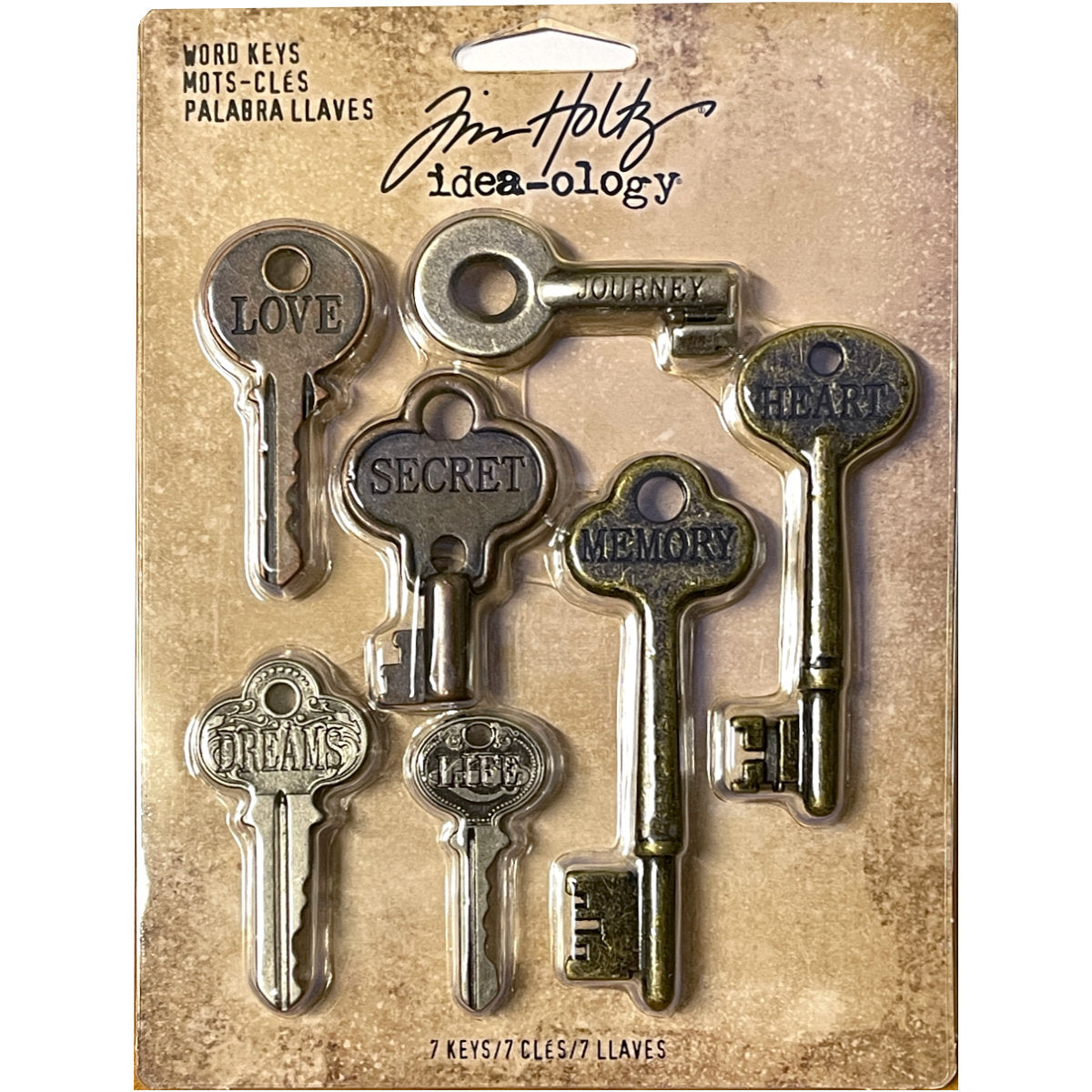 Word Keys, Metal Adornments&nbsp;... by Tim Holtz Idea-Ology - Solid metal keys inspired by vintage keys, each in a different shape and style, engraved with heartfelt words. Use for mixed media, assemblage projects, off-the-page marvels and party decor. 7 (seven) pieces, 1 (one) of each design. TH92680. uniquely shaped embellishment with words of : love, secret, life, memory, journey, dreams, heart.