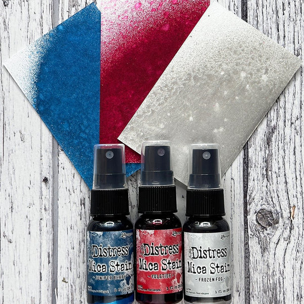 Distress Mica Stain Spray - Christmas set 5 ... by Tim Holtz... Limited Edition, seasonal colours of pearlescent shimmery pigment ink fusion in a sprayer bottle, each holding 29ml (1oz). This pack has 3 (three) colours (one of each) - 2023 Colours : Juniper Berry, Yuletide, Frozen Fog.   Tim Holtz Distress Mica Stains in these seasonal colours add beautiful pearlescent colourful layers to your artwork. 