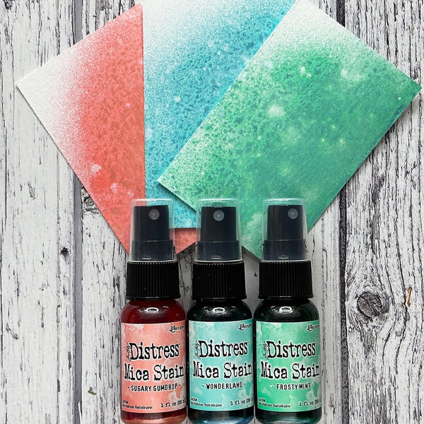 Distress Mica Stain Spray - Christmas set 6 ... by Tim Holtz... Limited Edition, seasonal colours of pearlescent shimmery pigment ink fusion in a sprayer bottle, each holding 29ml (1oz). This pack has 3 (three) colours (one of each) - Sugary Gumdrop, Wonderland, Frosty Mint.   Tim Holtz Distress Mica Stains in these seasonal colours add beautiful pearlescent colourful layers to your artwork. 