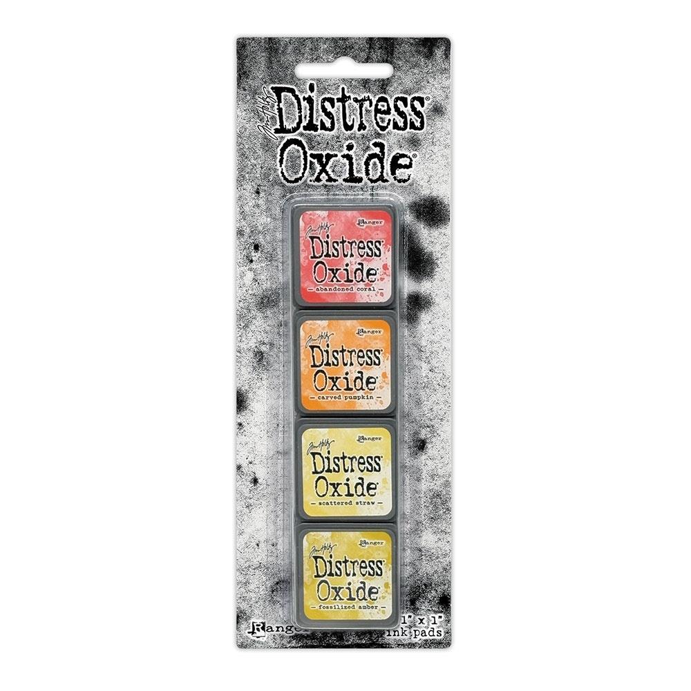 Mini Distress Oxide Ink Pads - Set 14 - by Tim Holtz and Ranger ... featuring water-reactive dye and pigment ink fusion that creates an oxidised effect when spattered, stamped, brushed and or sprayed with water. The colours are opaque and dry with a soft matte finish. Set of 4 (four) colours in Mini Ink Pad Cubes with 1" square raised felt, one of each (TDIK91608).

Colours in this set are ...
- Abandoned Coral
- Carved Pumpkin
- Scattered Straw
- Fossilized Amber
... one of each colour.