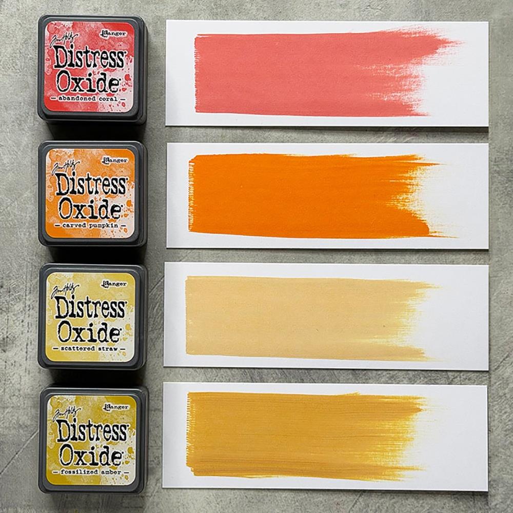 Mini Distress Oxide Ink Pads - Set 14 - by Tim Holtz and Ranger ... featuring water-reactive dye and pigment ink fusion that creates an oxidised effect when spattered, stamped, brushed and or sprayed with water. The colours are opaque and dry with a soft matte finish. Set of 4 (four) colours in Mini Ink Pad Cubes with 1" square raised felt, one of each (TDIK91608).

Colours in this set are ...
- Abandoned Coral
- Carved Pumpkin
- Scattered Straw
- Fossilized Amber
... one of each colour.