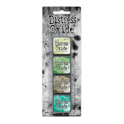 Mini Distress Oxide Ink Pads - Set 15 - by Tim Holtz and Ranger ... featuring water-reactive dye and pigment ink fusion that creates an oxidised effect when spattered, stamped, brushed and or sprayed with water. The colours are opaque and dry with a soft matte finish. Set of 4 (four) colours in Mini Ink Pad Cubes with 1" square raised felt, one of each (TDIK91615).

Colours in this set are ...
- Shabby Shutters
- Mowed Lawn
- Forest Moss
- Lucky Clover
... one of each colour.
