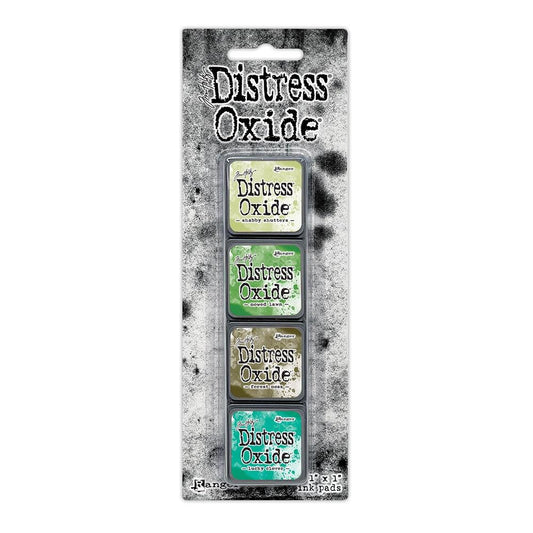 Mini Distress Oxide Ink Pads - Set 15 - by Tim Holtz and Ranger ... featuring water-reactive dye and pigment ink fusion that creates an oxidised effect when spattered, stamped, brushed and or sprayed with water. The colours are opaque and dry with a soft matte finish. Set of 4 (four) colours in Mini Ink Pad Cubes with 1" square raised felt, one of each (TDIK91615).

Colours in this set are ...
- Shabby Shutters
- Mowed Lawn
- Forest Moss
- Lucky Clover
... one of each colour.