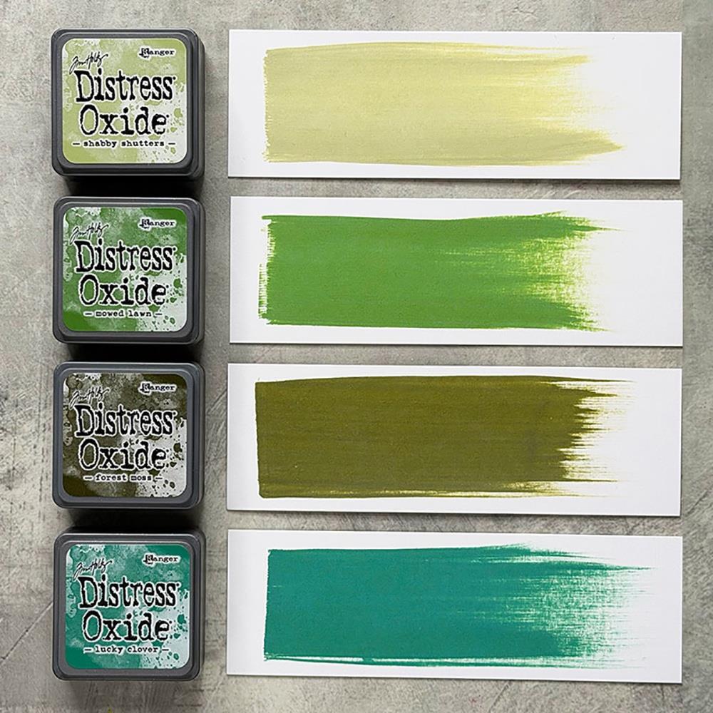 Mini Distress Oxide Ink Pads - Set 15 - by Tim Holtz and Ranger ... featuring water-reactive dye and pigment ink fusion that creates an oxidised effect when spattered, stamped, brushed and or sprayed with water. The colours are opaque and dry with a soft matte finish. Set of 4 (four) colours in Mini Ink Pad Cubes with 1" square raised felt, one of each (TDIK91615).

Colours in this set are ...
- Shabby Shutters
- Mowed Lawn
- Forest Moss
- Lucky Clover
... one of each colour.