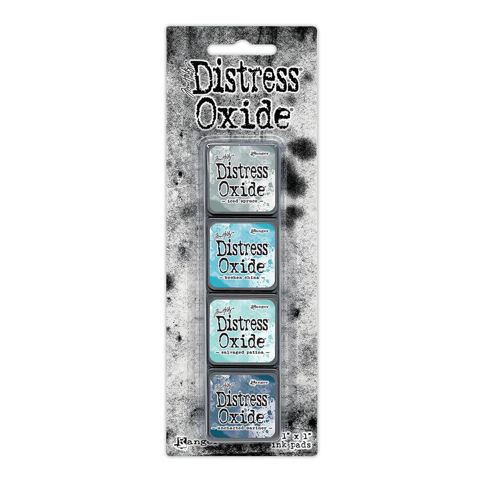 Mini Distress Oxide Ink Pads - Set 16 - by Tim Holtz and Ranger ... featuring water-reactive dye and pigment ink fusion that creates an oxidised effect when spattered, stamped, brushed and or sprayed with water. The colours are opaque and dry with a soft matte finish. Set of 4 (four) colours in Mini Ink Pad Cubes with 1" square raised felt, one of each (TDIK91622).

Colours in this set are ...
- Iced Spruce
- Broken China
- Salvaged Patina
- Uncharted Mariner
... one of each colour.