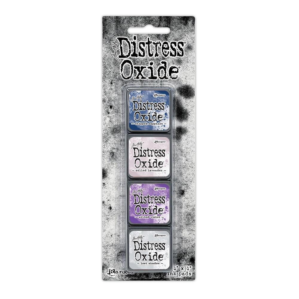 Mini Distress Oxide Ink Pads - Set 17 - by Tim Holtz and Ranger ... featuring water-reactive dye and pigment ink fusion that creates an oxidised effect when spattered, stamped, brushed and or sprayed with water. The colours are opaque and dry with a soft matte finish. Set of 4 (four) colours in Mini Ink Pad Cubes with 1" square raised felt, one of each (TDIK91639).

Colours in this set are ...
- Chipped Sapphire
- Milled Lavender
- Wilted Violet
- Lost Shadow
... one of each colour.