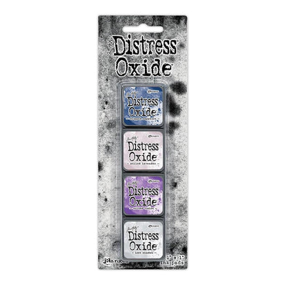 Mini Distress Oxide Ink Pads - Set 17 - by Tim Holtz and Ranger ... featuring water-reactive dye and pigment ink fusion that creates an oxidised effect when spattered, stamped, brushed and or sprayed with water. The colours are opaque and dry with a soft matte finish. Set of 4 (four) colours in Mini Ink Pad Cubes with 1" square raised felt, one of each (TDIK91639).

Colours in this set are ...
- Chipped Sapphire
- Milled Lavender
- Wilted Violet
- Lost Shadow
... one of each colour.