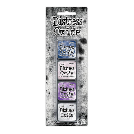 Mini Distress Oxide Ink Pads - Set 17 - by Tim Holtz and Ranger ... featuring water-reactive dye and pigment ink fusion that creates an oxidised effect when spattered, stamped, brushed and or sprayed with water. The colours are opaque and dry with a soft matte finish. Set of 4 (four) colours in Mini Ink Pad Cubes with 1" square raised felt, one of each (TDIK91639).

Colours in this set are ...
- Chipped Sapphire
- Milled Lavender
- Wilted Violet
- Lost Shadow
... one of each colour.