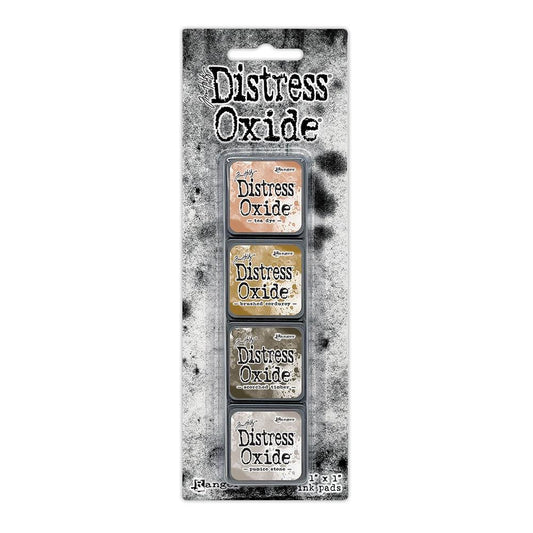 Mini Distress Oxide Ink Pads - Set 18 - by Tim Holtz and Ranger ... featuring water-reactive dye and pigment ink fusion that creates an oxidised effect when spattered, stamped, brushed and or sprayed with water. The colours are opaque and dry with a soft matte finish. Set of 4 (four) colours in Mini Ink Pad Cubes with 1" square raised felt, one of each (TDIK91646).

Colours in this set are ...
- Tea Dye
- Brushed Corduroy
- Scorched Timber
- Pumice Stone
... one of each colour.
