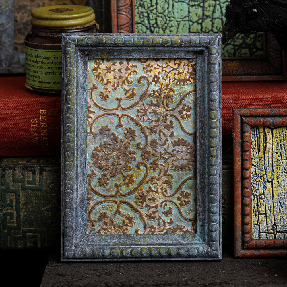 Tapestry - Multi Layered Texture Fades Embossing Folder ... by Tim Holtz and Sizzix (no.666388).    This easy to use dimensional embossing folder creates a beautiful ornate vintage wallpaper pattern over the whole surface of the folder, created with different heights to give fabulous layered effects. Another amazing design from Tim, perfect for cards, journal pages, bookmaking, book covers, papercrafts and visual arts.  Photo of an example in use.