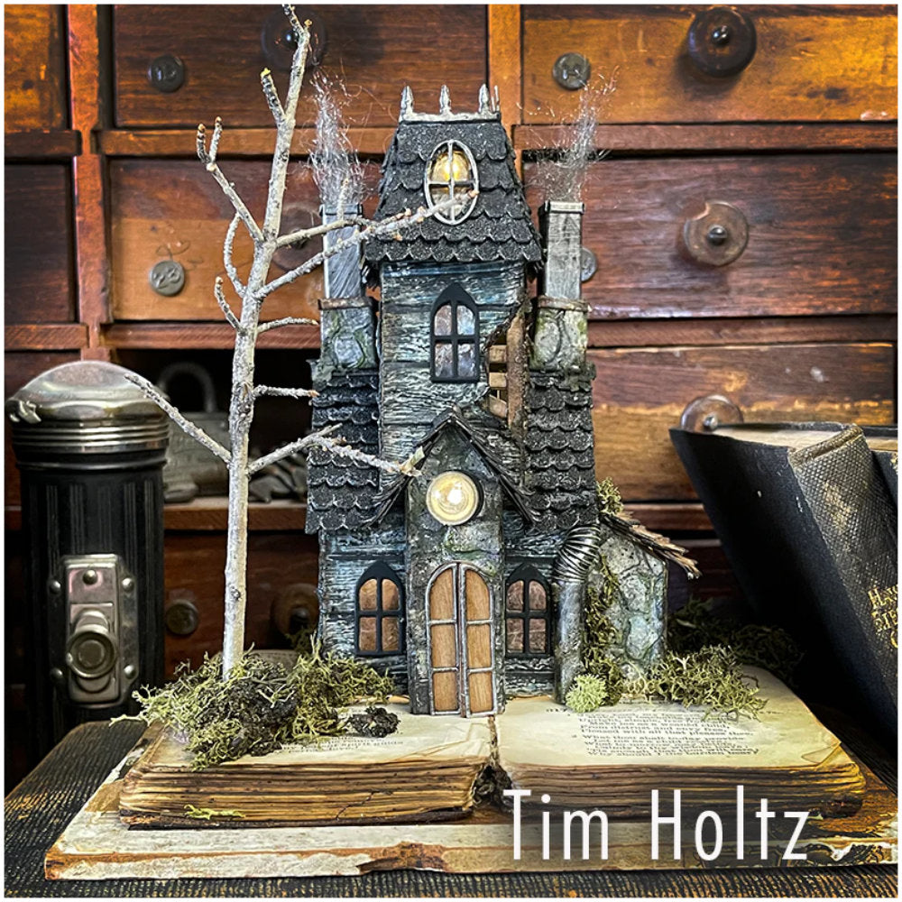 Village Collection ... Thinlits - Die Cutting Templates by Tim Holtz and Sizzix (product id 665564). Imagine building a miniature row of buildings with all their features ease! Create the shape of a building and add steeples, windows, tiles, doors, chimneys, all with depth, colour variations and 3D elements without spending hours fussy cutting with scissors. Photo of beautiful manor by Tim Holtz