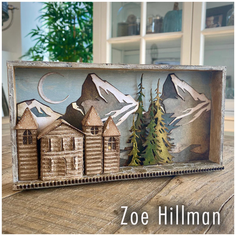 Village Collection ... Thinlits - Die Cutting Templates by Tim Holtz and Sizzix (product id 665564). Imagine building a miniature row of buildings with all their features ease! Create the shape of a building and add steeples, windows, tiles, doors, chimneys, all with depth, colour variations and 3D elements without spending hours fussy cutting with scissors. Photo of peaceful log cabin alpine village by Zoe Hillman
