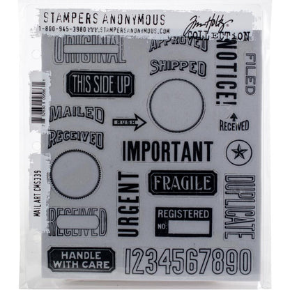 Mail Art ... by Tim Holtz and Stampers Anonymous (cms339). Selection of labels, notes, arrows, numbers and words, red rubber stamps for cardmaking, junk journals, planners, mixed media, art journaling and papercrafts. Set of 21 (twenty one) stamps. This collection includes a variety of authentic shipping, postage, parcel, stationery and bookkeeping labels, words, stamp images, and more. Photo of the red rubber set.