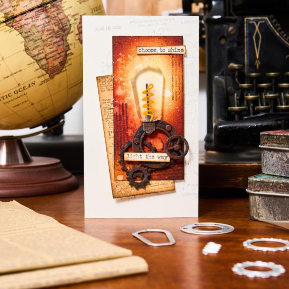 Industrial - Sizzix Thinlits die cutting templates by Tim Holtz. 37 (thirty seven) assorted patterns and shapes for a complete steampunk makeover including vintage lightglobe, gauge or dial, gears, numbers, pipes and corners, tap, drip, round washer, arrow bolt tops and more (no.666874). Photo of card ideas.