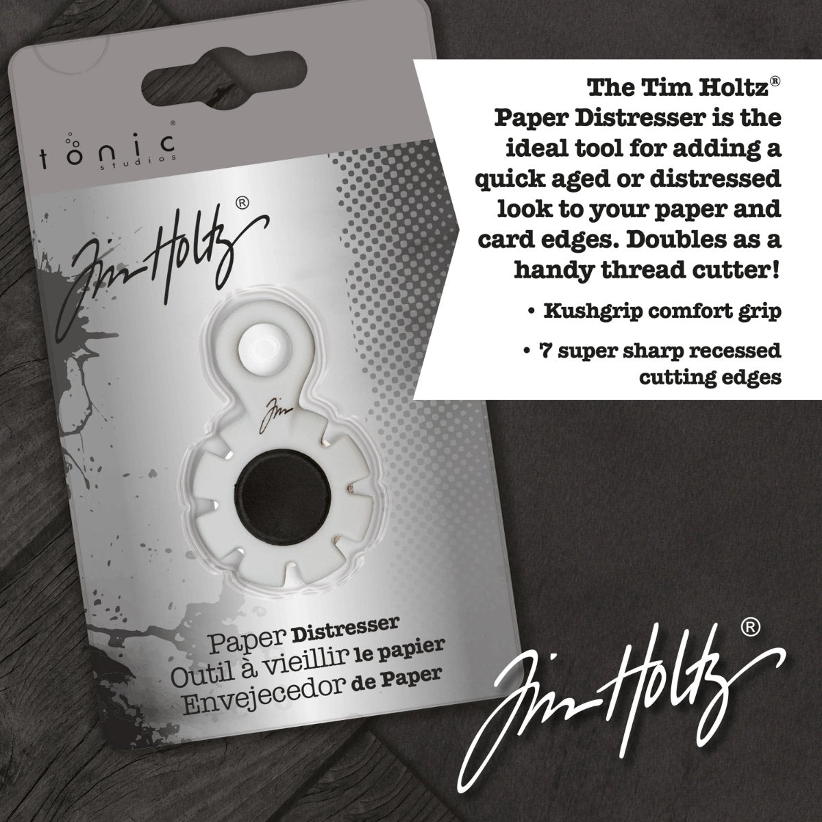 Paper Distresser - by Tim Holtz and Tonic Studios ... this is a tool for roughing up paper, cardstock edges and cutting threads in papercrafts, mixed media and tactile crafts. Includes a Kushgrip holder, hanging loop and 7 sharp recessed edges. Ergonomic Kushgrip round centre spot for comfort during handling, with very sharp steel blades recessed within the grey round plastic surround. It is safe to hold and easy to use. Photo from Tonic Studios of packaging.
