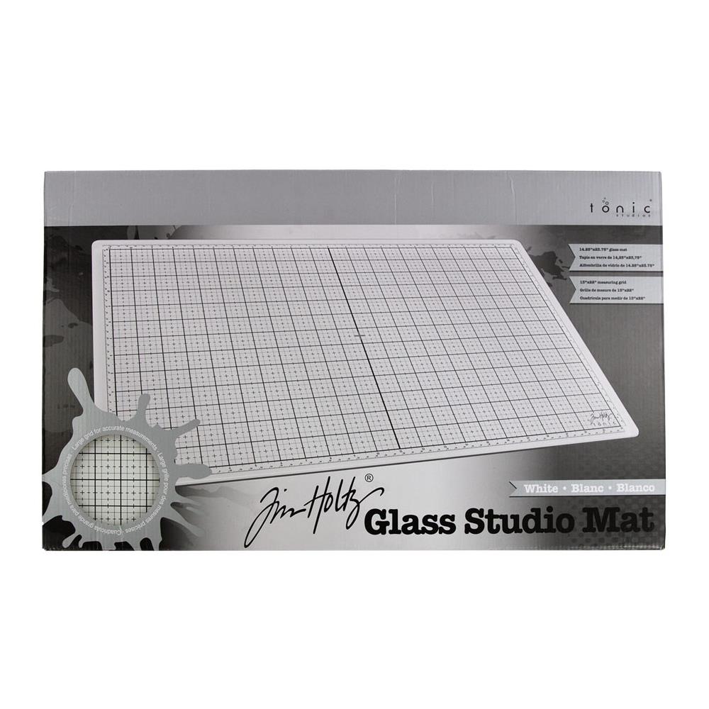 White Studio Glass Media Mat - Large Creative Surface 14"x23" ... by Tim Holtz and Tonic Studios. Tempered white glass mat with gridlines, silicon feet with both metric and imperial measurements.

Tim Holtz and Tonic Studio have made for you, this fantastic multi-functional tool for creating and crafting in your workspace, whether in a studio, craft corner at home or during lunch at the office ... it is stylish and practical.