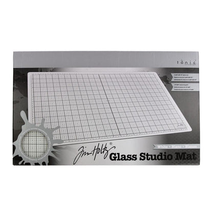White Studio Glass Media Mat - Large Creative Surface 14"x23" ... by Tim Holtz and Tonic Studios. Tempered white glass mat with gridlines, silicon feet with both metric and imperial measurements.

Tim Holtz and Tonic Studio have made for you, this fantastic multi-functional tool for creating and crafting in your workspace, whether in a studio, craft corner at home or during lunch at the office ... it is stylish and practical.