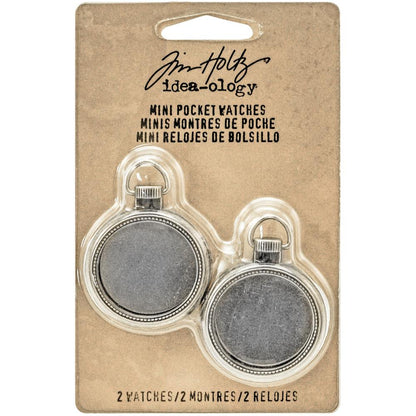 Mini Pocket Watch - Tim Holtz Idea-Ology ... small fob watch frames made of metal with a glass front piece. Each is 1 1/4" wide, pack of 2 (two) frames.  These 2 (two) vintage style, silver coloured metal pocket watch frames are ideal to turn into a locket, photo frame, miniature garden, or add to a mixed media artwork. Each metal pocket watch has a removable back to customise the inside area. It has a glass-like front piece (feels like glass) and a handy template for each size. TH93274