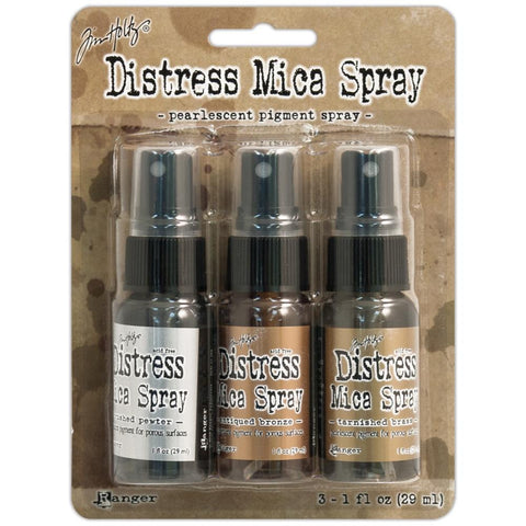 Distress Mica Spray by Tim Holtz... 3 bottles with sprayer nozzles - Antique Bronze, Brushed Pewter and Tarnished Brass. 1 fl oz (29 ml), one of each colour.  These pearlescent sprays will add metallic shimmery layers of Brushed Pewter (silver), Antique Bronze and Tarnished Brass (similar to gold) to your project. Mica powder and rich metallic pigments are mixed with clear tinted ink is just gorgeous! Each colour has a beautiful shimmery shiny metallic finish.