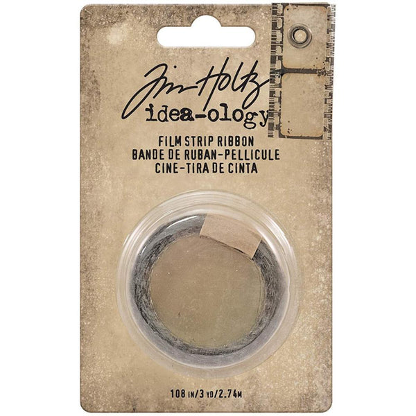 Film Strip Ribbon - Idea-Ology Trimmings by Tim Holtz ... 3 yards (108 inches or 2.74 metres) of printed transparent frames (plastic, acetate) with realistic (miniaturised) camera film cog holes. Roll is 17mm or 11/16" wide. Pack has a sample attached