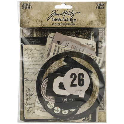 Urban Layers - Tim Holtz Idea-Ology die cuts&nbsp;... a curated collection of salvaged elements used for layering in papercrafts and visual arts of all kinds. 65 pieces.  This collection is a wonderful mix of vintage inspired die-cut pieces in neutral colour tones, with designs of giant numbers (numerals), banners (do not crush, glass), old tickets, labels, dials, ruler strip, bullseye, clockfaces and a whole lot more. 