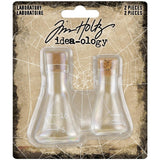 Laboratory Flasks ... by Tim Holtz - Miniature glass flasks with cork lids, used to hold objects for assemblage projects, diorama, off-the-page marvels and party decor.  Package of 2 (two) small glass bottles (in the shape of scientist flasks) with little cork lids and measurement markings. Sizes (approx) : 2" x 1 1/16" and 2 3/8" x 1 1/2".