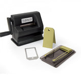 Tim Holtz Sidekick by Sizzix, portable black die cutting and embossing machine, photo shows the machine and simplicity way of cutting a tag.