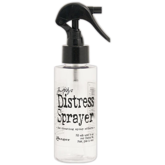 Distress Sprayer - by Tim Holtz and Ranger ... Empty spritzer bottle for spray effects in art  ... holds up to 4 fl oz. Use with water or ink, has a locking mechanism (flip switch) for travel and storage. Pack contains 1 (one) empty 4 (four) fluid ounce bottle with large trigger sprayer, clear plastic with black sprayer. Overall size is 16cm high, main part of the bottle is 93mm x 43mm wide.