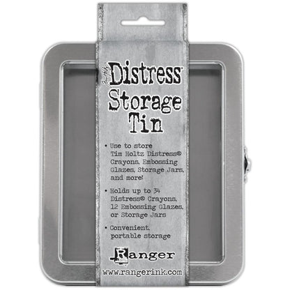 Distress Storage Tin ... by Tim Holtz and Ranger - 1 (one) empty metal container with hinged lid and window. Originally named the "Distress Crayon Storage Tin". Holds up to ... - 34 x Distress Crayons, - 12 x Distress Embossing Glaze, - 12 x Ranger and Distress 1oz sized jars, - 12 x jars of Ranger Stickles Gel, - 70 x Distress Woodless Watercolour Pencils, - 4 x rolls of Idea-Ology Collage paper, ... and anything else you can fit in this handy sized tin.  Tin size : (approx) 6" x 7" x 2".