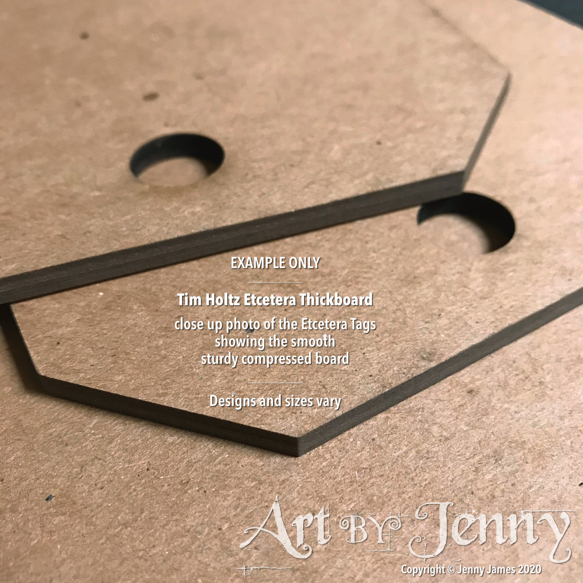 closeup photograph showing an example of the Etcetera Thickboard by Tim Holtz and Stampers Anonymous. Etcetera Thickboard Tags, Small ... by Tim Holtz - 3 (three) hardboard pieces, each 5.5" x 10", 3mm thick. Tim Holtz Etcetera Thickboard is a kraft brown hardboard substrate, a 2-3mm thick wood-like material used for mixed media. Etcetera tags are made with compressed paper, made to have the look and feel of mdf or craftwood.
