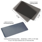 Tim Holtz Sidekick by Sizzix, portable black die cutting and embossing machine, photo shows the embossing pad and cutting plates with sizes marked in inches